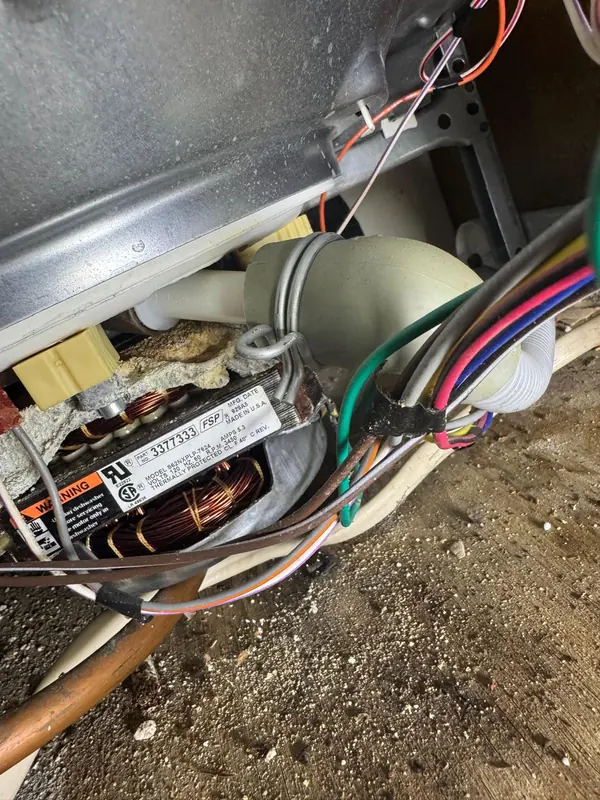 Label on a dishwasher motor reading part number 3377333, 120 volts, 5.3 amps, 3450 rpm