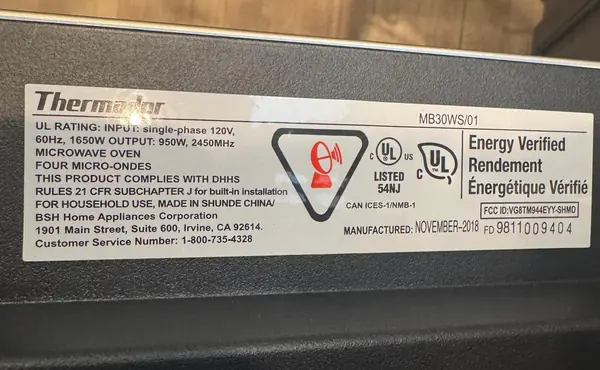 Rating label on a Thermador built-in microwave showing model MB30WS/01, manufactured November 2018, with its FD number